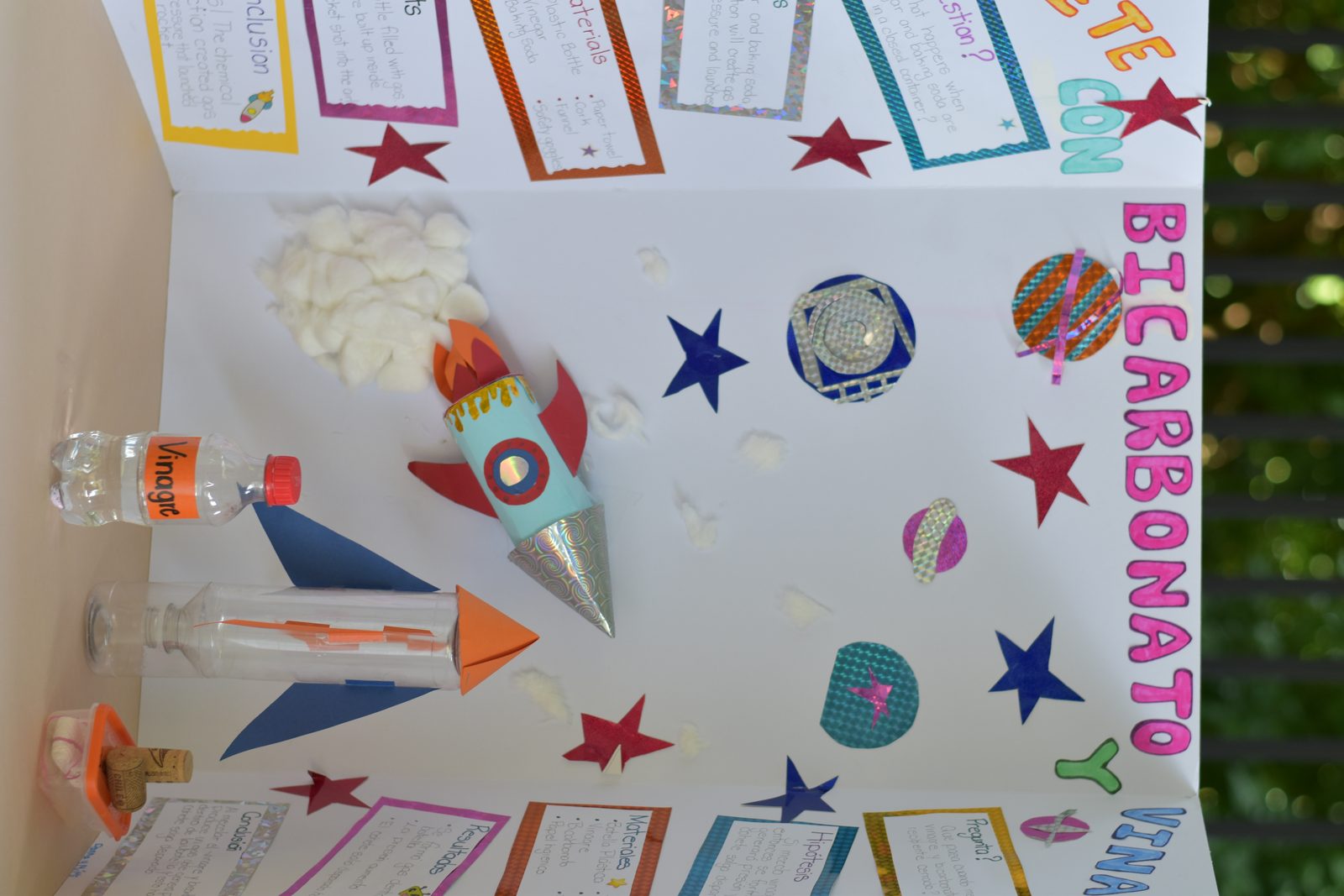 Hand-painted school art project displaying rockets, stars, and educational elements